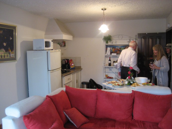 A downtown Cuenca apartment, one room with a tiny kitchen.  Taken from the corner near the television.