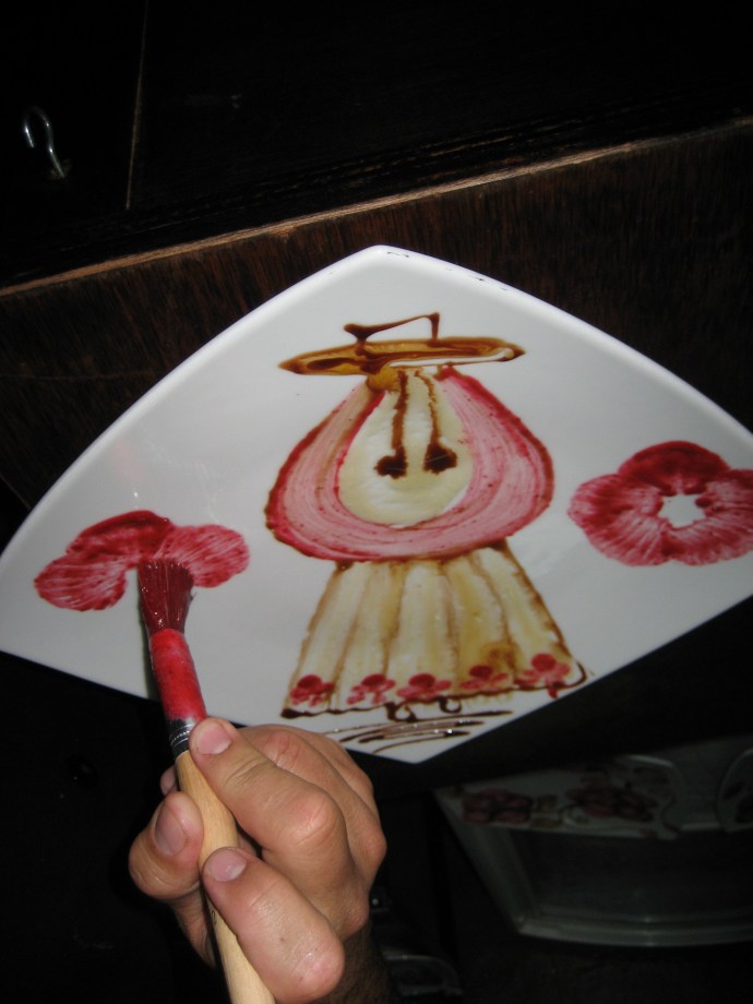 Step 11- With the basic design completed, the chef now adds flowers and other details.