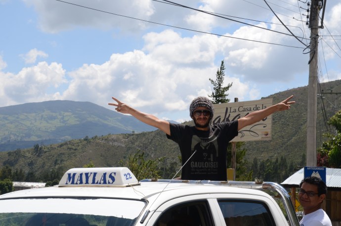 Estaban in the back of a Gualaceo taxi