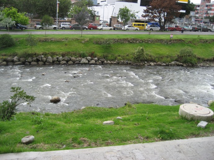 Walking paths are on either side of the Rio Tomebamba